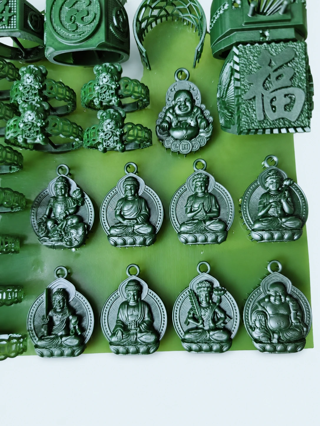 Green resin jewelry pendants and ring patterns with detailed relief